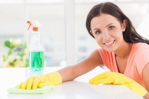 Cleaning team members standing in a professional workspace under an anti-slavery commitment