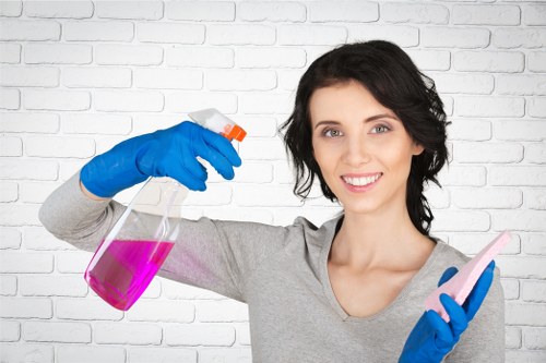 Deep cleaning cleaner wearing protective equipment while using chemicals