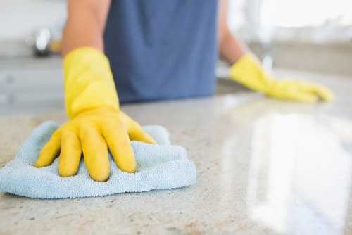 Trained cleaner using protective equipment during a deep clean